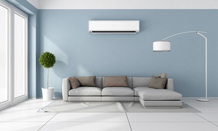 split system air conditioner installed on blue wall.